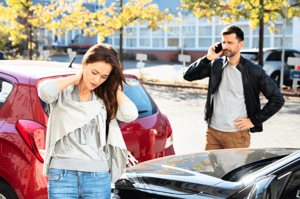 Man and woman by red car in Fort Lauderdale