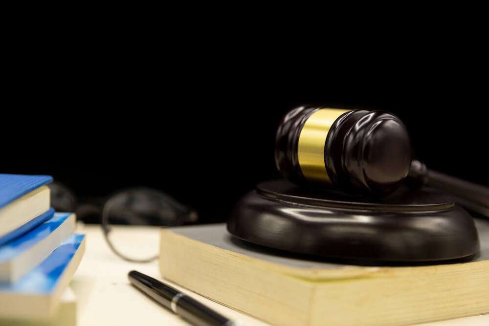 Gavel and books on desk