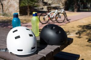bicycle helmets on park table