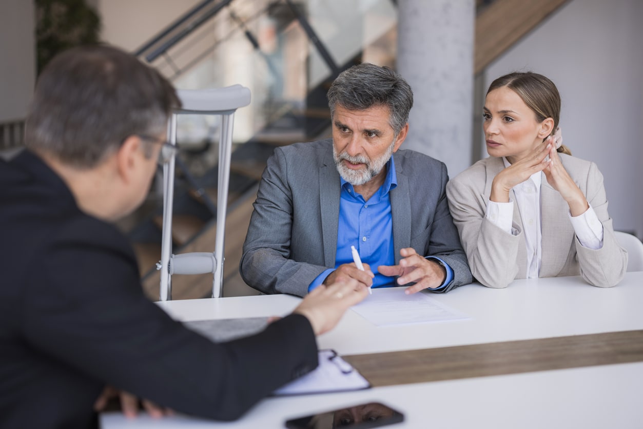 Lawyer consulting couple about personal injury claim